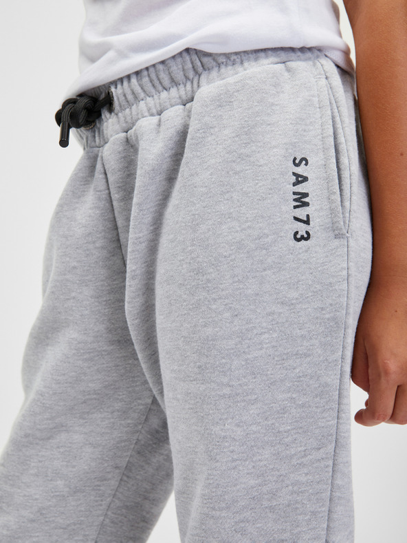 Sam 73 Svetlo sive otroške črtaste trenirke SAM 73 Riardin